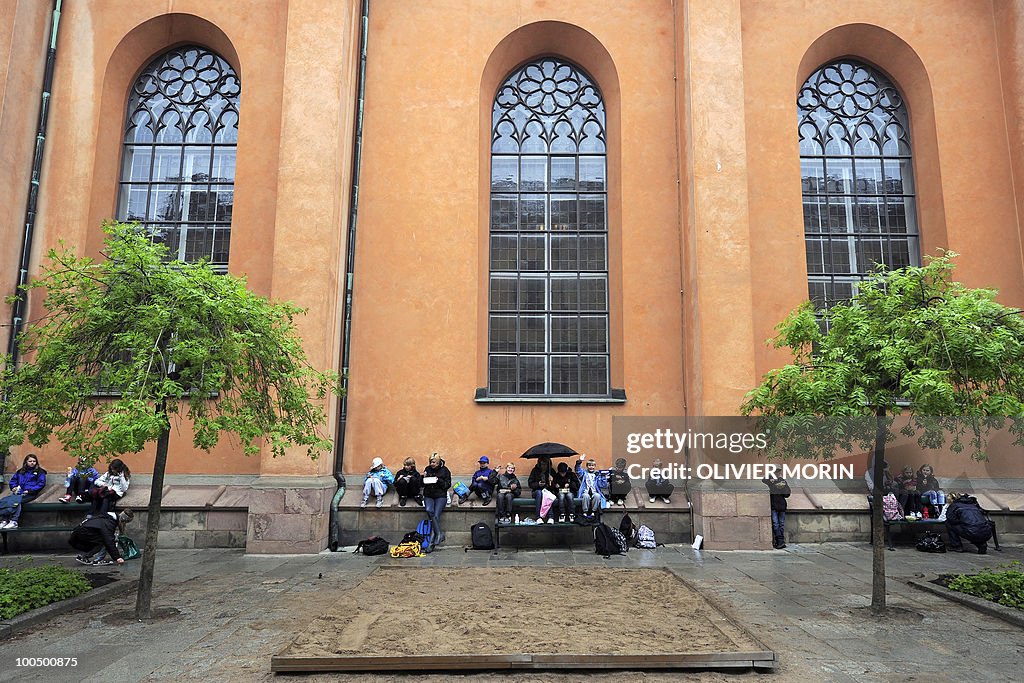 Schoolchildren enjoy a picnic outside of