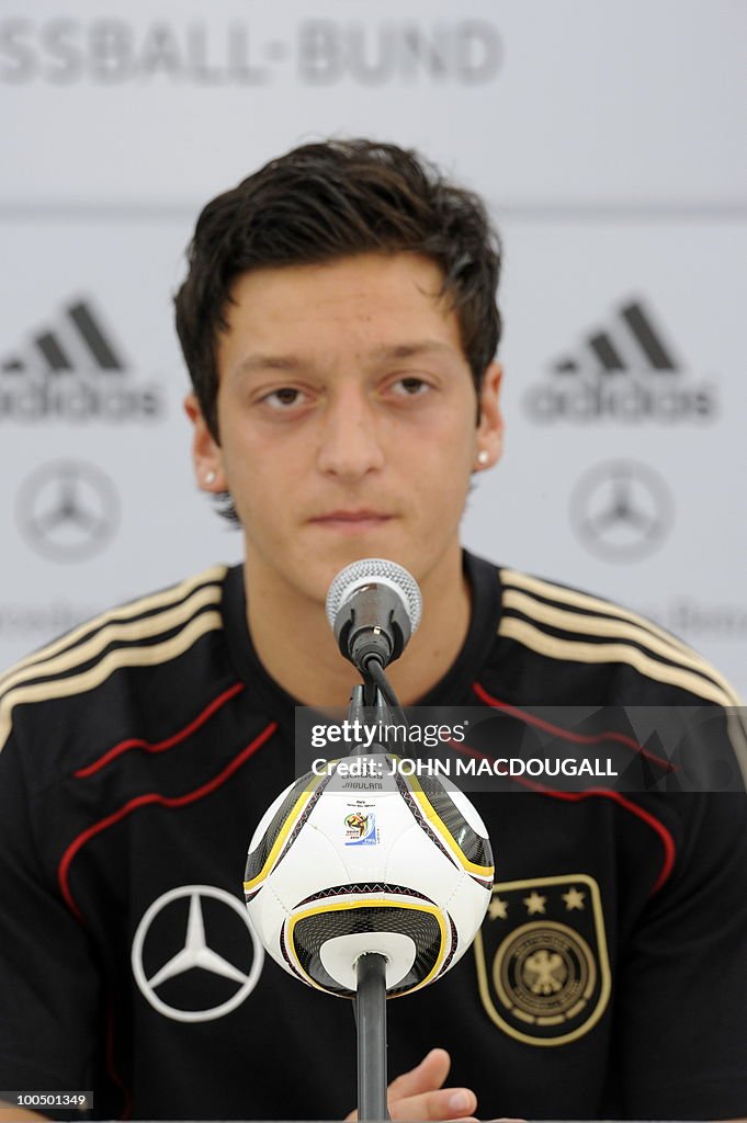 Germany's midfielder Mesut Oezil address