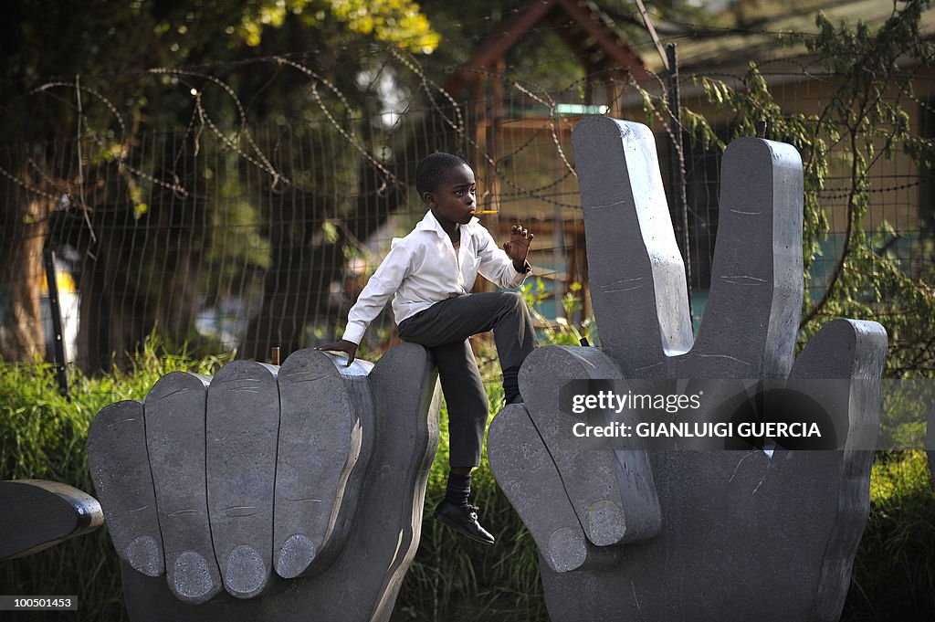 A South African child plays on a sculptu