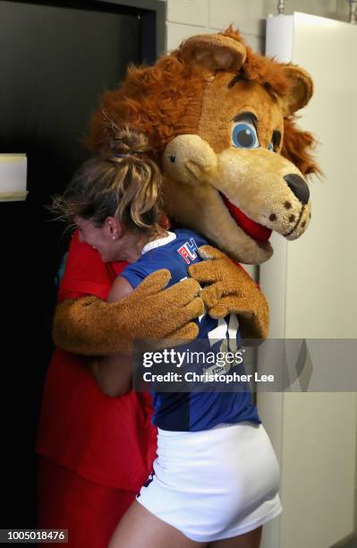 Marcela Casale of Italy hugs Jasper as she celebrates their victory during the Pool A game between China and Italy of the FIH Womens Hockey World Cup...