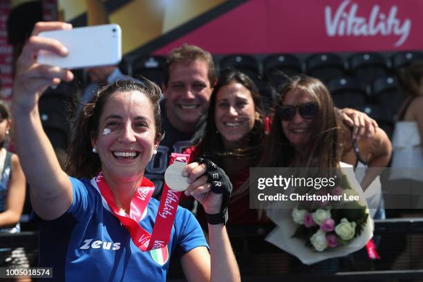 Lara Oviedo of Italy with her Player of the Match award takes a selfie with friends and family during the Pool A game between China and Italy of the...