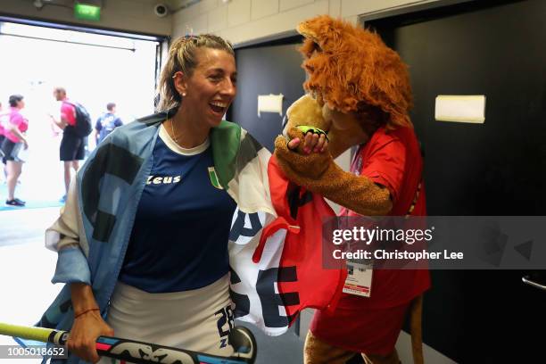 Ivanna Pessina of Italy celebrates their victory with Jasper during the Pool A game between China and Italy of the FIH Womens Hockey World Cup at Lee...