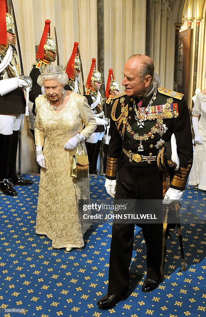 Britain's Queen Elizabeth II (L) accompa