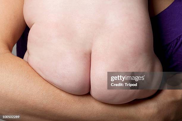 mother holding naked baby girl (6-9 months) - baby bottom stock pictures, royalty-free photos & images