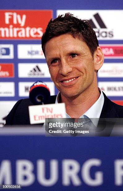 Sport director Bastian Reinhardt smiles during a press conference to present the new head coach Armin Veh and the new sport director Bastian...