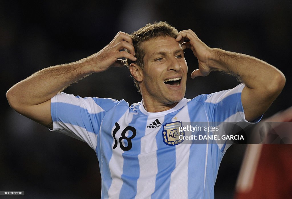 Argentina's forward Martin Palermo react