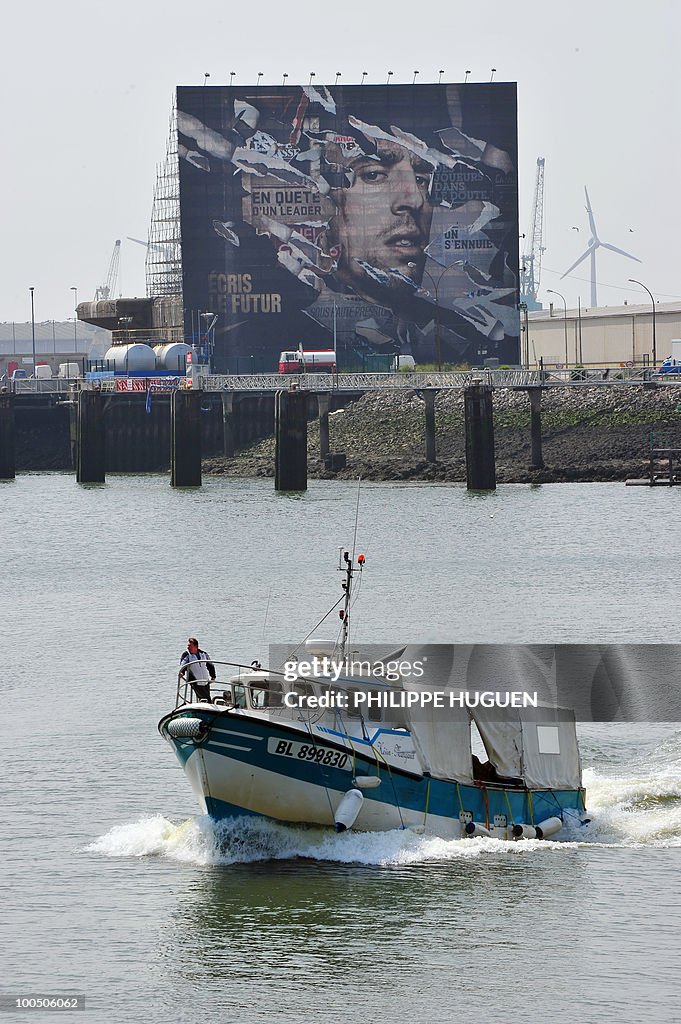 A fishing boat sails in front of a 800 m