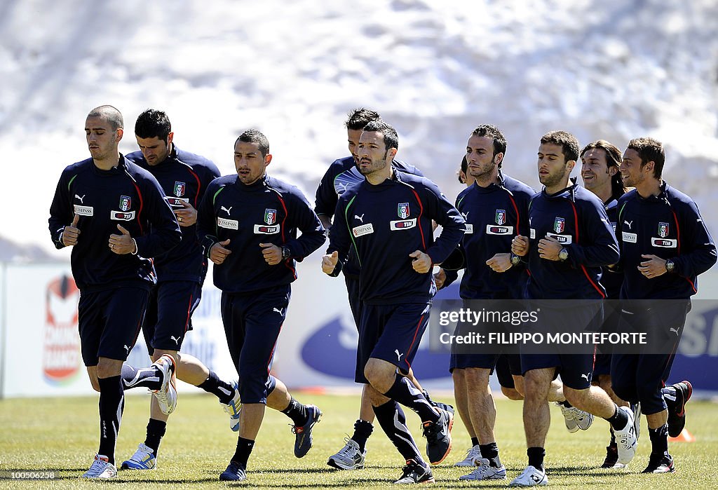 Italy's soccer team's players run during