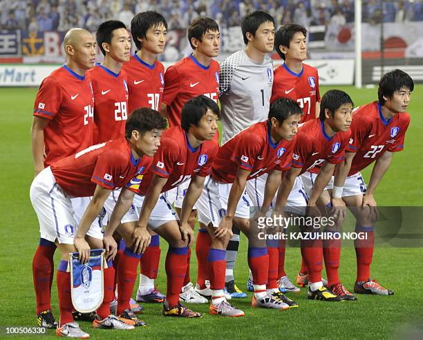 South Korea's starting players pose in a photo session prior to their international friendly football match against Japan at Saitama Stadium,...