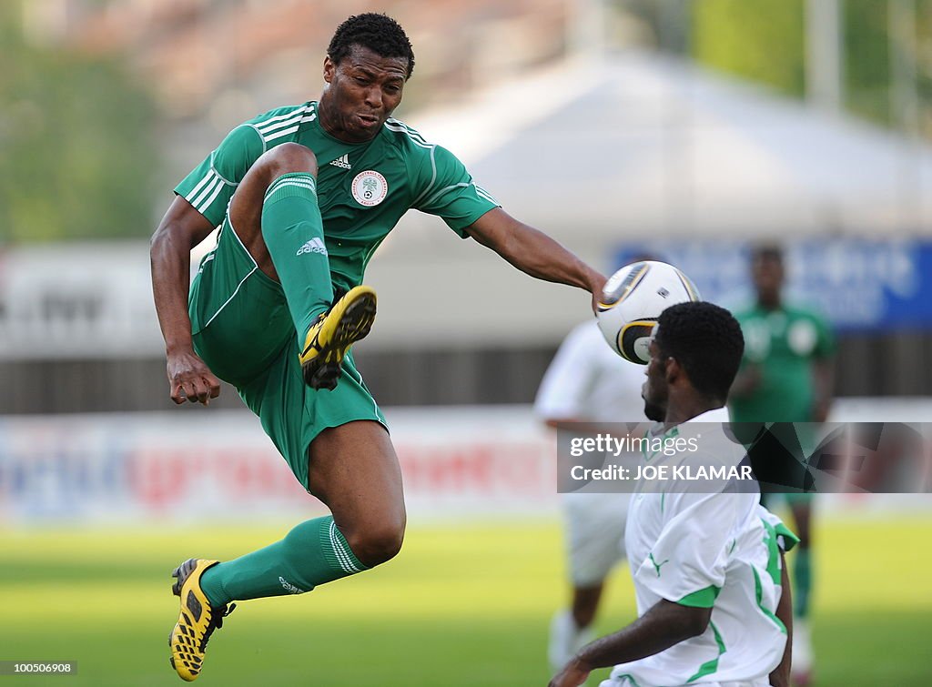 Nigeria's Kalu Uche kicks a ball during