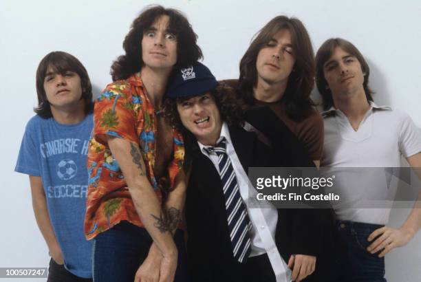 Malcolm Young, Bon Scott, Angus Young, Cliff Williams and Phil Rudd of Australian rock band AC/DC pose in London, England in August 1979.
