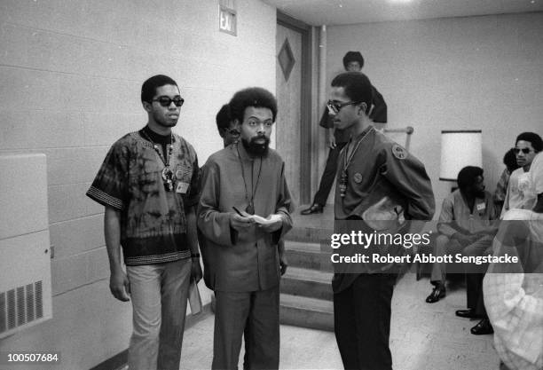 African American poet, writer, and civil rights activist Amiri Baraka confers with a group of attendees at the Congress of African Peoples, Atlanta,...