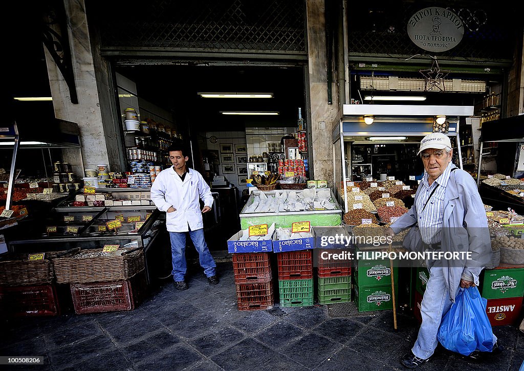 An elderly man shops in Athens central m