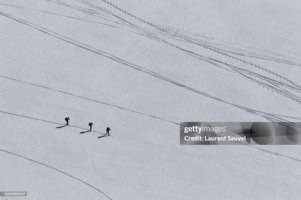 Top view of three people skiing near Mont Blanc, Chamonix-Mont-Blanc, France