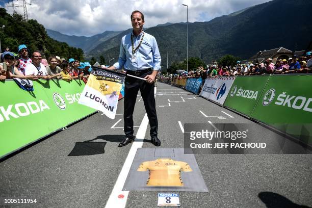 General Director of the Tour de France, France's Christian Prudhomme stands at the line prior to giving the start of the 17th stage of the 105th...