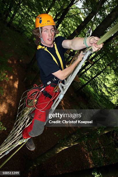 Climber Daniel in action during a climbing session at the GHW tightrobe climbing garden on May 25, 2010 in Hueckeswagen, Germany.