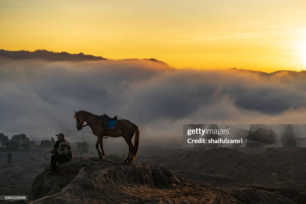 Unidentified local people or Bromo Horseman at the mountainside of Mount Bromo, Semeru, Tengger National Park, East Java of Indonesia.