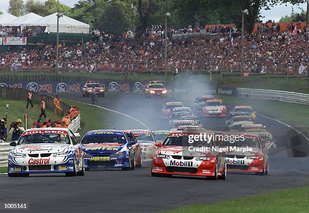 Greg Murphy races alongside Mark Skaife at the start of race 3 during round 12 of the Shell championship series at Pukekohe Park Raceway, south of...