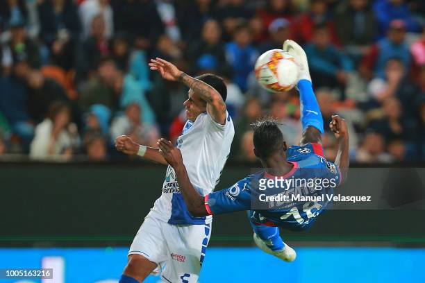 Aviles Hurtado of Monterrey tries an overhead shot against Emmanuel Garcia of Pachuca during the 1st round match between Pachuca and Monterrey as...
