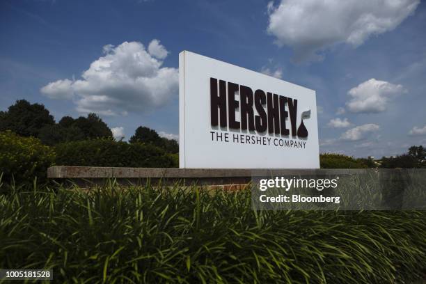 Signage stands on display outside Hershey Co. Headquarters in Hershey, Pennsylvania, U.S., on Friday, July 13, 2018. Hershey Co. Is scheduled to...