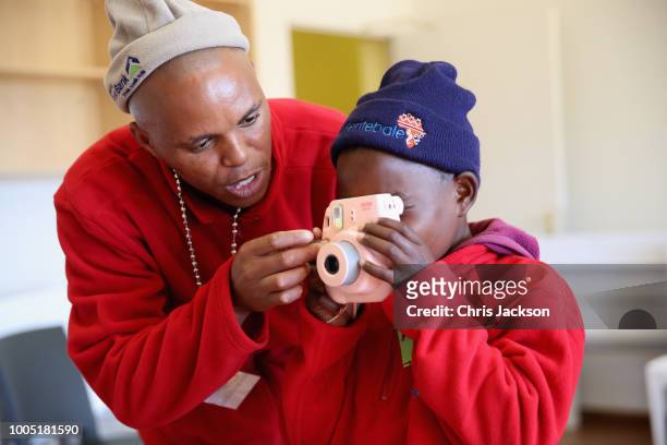 Child uses a camera attending the Winter Camp at Sentebale's Mamohato Children's Centre on June 22, 2018 near Maseru, Lesotho. The week-long...