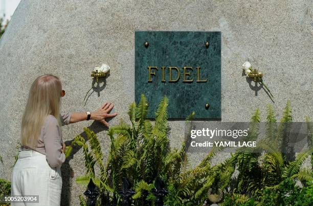 The widow of Cuban leader Fidel Castro, Dalia Soto del Valle, visits his tomb at the Santa Ifigenia cemetery in Santiago de Cuba, eastern Cuba, on...