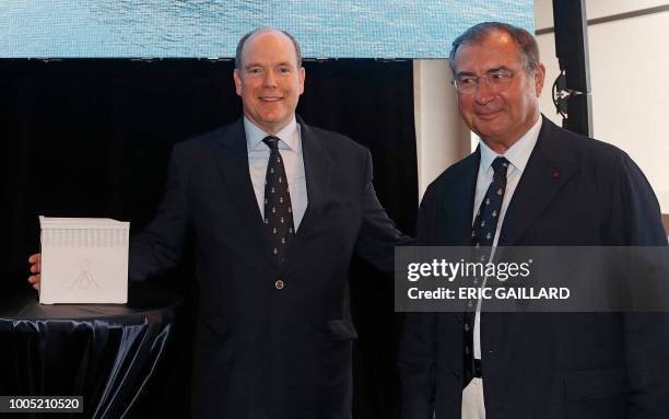 Prince Albert II of Monaco poses alongside Martin Bouygues - Chairman and Chief Executive Officer of French industrial and telecoms conglomerate...