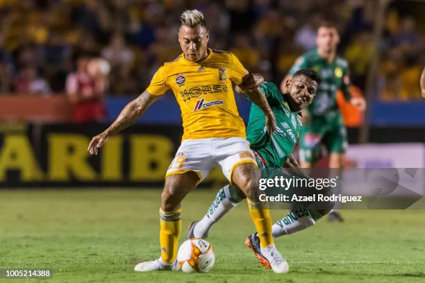 Eduardo Vargas of Tigres fights for the ball with Walter Gonzalez of Leon during the 1st round match between Tigres UANL and Leon as part of the...