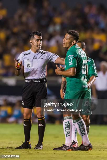 Referee Adonai Escobedo argues with Alexander Mejia of Leon during the 1st round match between Tigres UANL and Leon as part of the Torneo Apertura...