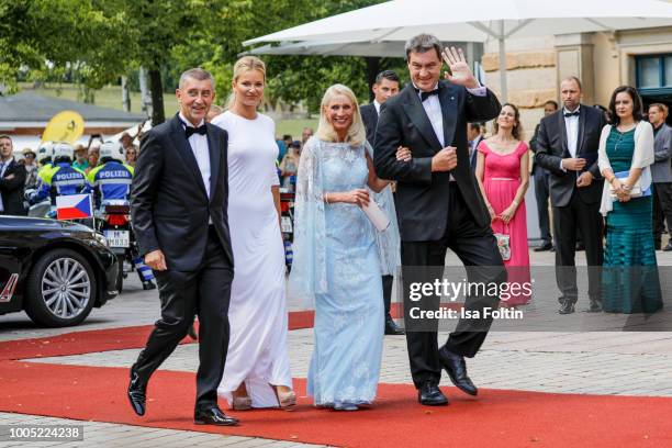 Bavarian state Premier Markus Soeder next to his wife Karin Baumueller as they arrive with Czech Prime Minister Andrej Babis and his wife Monika...