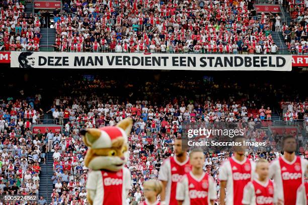 Supporters of Ajax shows a banner Deze man verdient een standbeeld during the UEFA Champions League match between Ajax v SK Sturm Graz at the Johan...