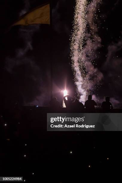 Fireworks are seen behind fans during the season opening ceremony prior the 1st round match between Tigres UANL and Leon as part of the Torneo...