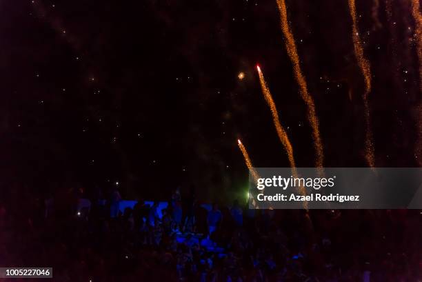 Fireworks are seen behind fans during the season opening ceremony prior the 1st round match between Tigres UANL and Leon as part of the Torneo...