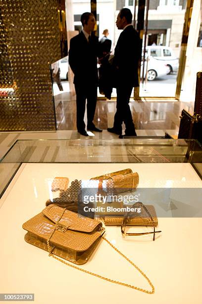 Louis Vuitton branded goods sit on display at the LVMH Moet Hennessy Louis Vuitton SA "maison" store in New Bond Street in London, U.K., on Tuesday,...