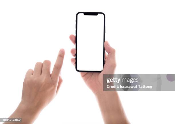 smartphone in female hands taking photo isolated on white blackground - hand mobile stock-fotos und bilder