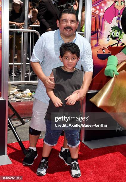 Personality Guillermo Rodriguez and son Benji Rodriguez arrive at the Los Angeles premiere of Warner Bros. Animations' 'Teen Titans Go! To the...