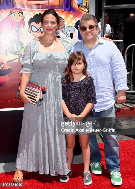 Actors Meredith Salenger, Patton Oswalt and daughter Alice Rigney Oswalt arrive at the Los Angeles premiere of Warner Bros. Animations' 'Teen Titans...