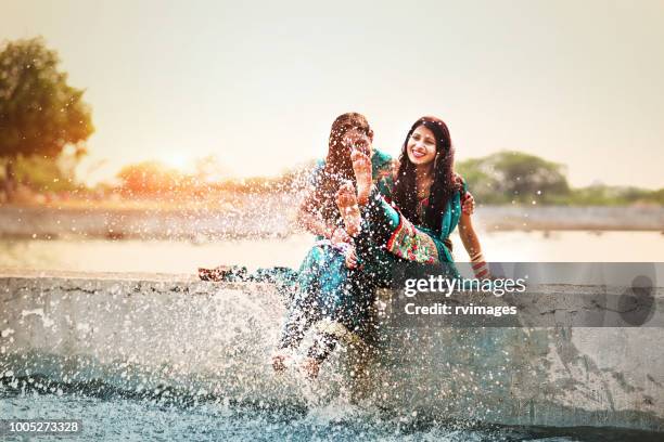 woman doing fun on vacations - indian family vacation stock pictures, royalty-free photos & images