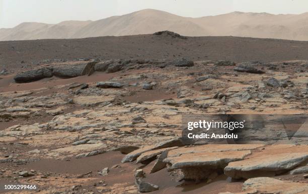 Photo, covered by NASA's Curiosity Mars rover, shows series of sedimentary deposits in the Glenelg area of Gale Crater, from a perspective in...