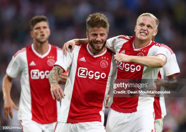 Lasse Schone of Ajax celebrates with team mate Donny van de Breek after scoring his team's second goal during the first leg UEFA Champions League...