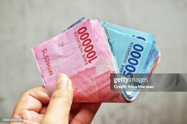 Many Rupiah Indonesian Rupiah Photos and Premium High Res Pictures - Getty Images