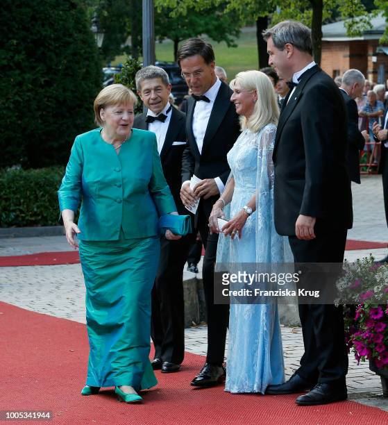 German Chancellor Angela Merkel, her husband Joachim Sauer, Dutch Prime Minister Mark Rutte, State Premier Markus Soeder and his wife Karin...