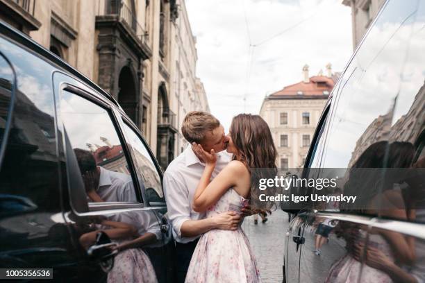 photo of a lovely couple resting in the city - casal beijando na rua imagens e fotografias de stock