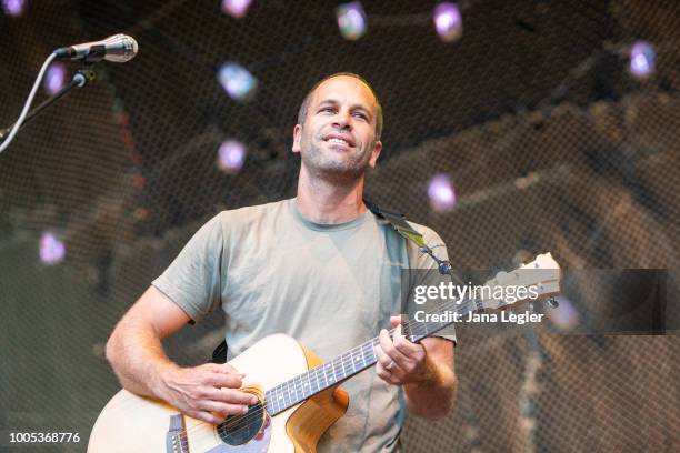 American singer Jack Johnson performs live on stage during a concert at the Zitadelle Spandau on July 25, 2018 in Berlin, Germany.