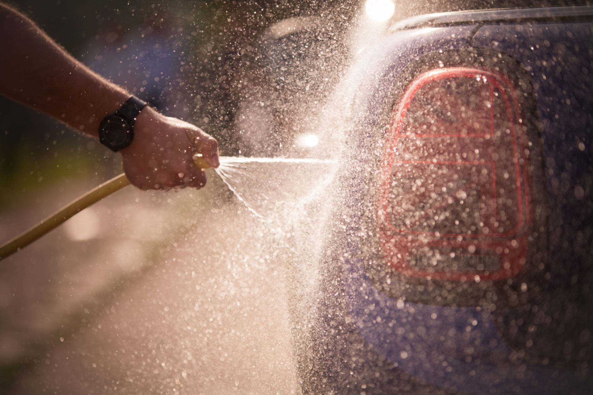 Man washing a car Man washing a car