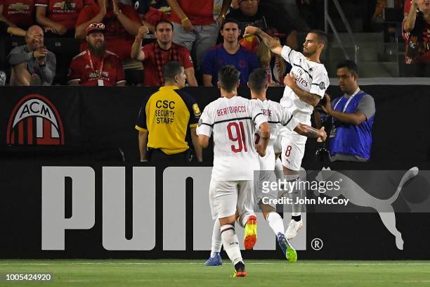Suso of A.C. Milan celebrates with teammates after scoring a first half goal against Manchester United during the International Champions Cup 2018 at...