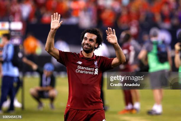 Mohammed Salah of Liverpool salutes to the fans at the end of a friendly match between Manchester City and Liverpool FC within the International...