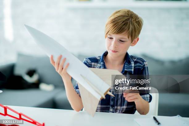 building a model rocket - model rocket stock pictures, royalty-free photos & images