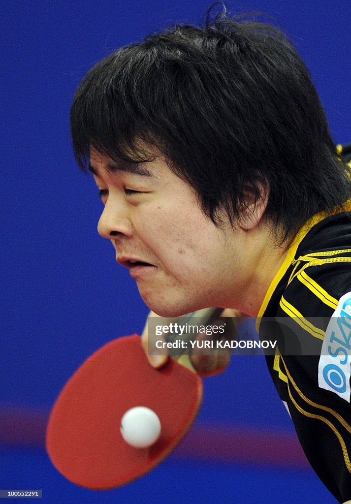 Seiya Kishikawa of Japan returns a servi