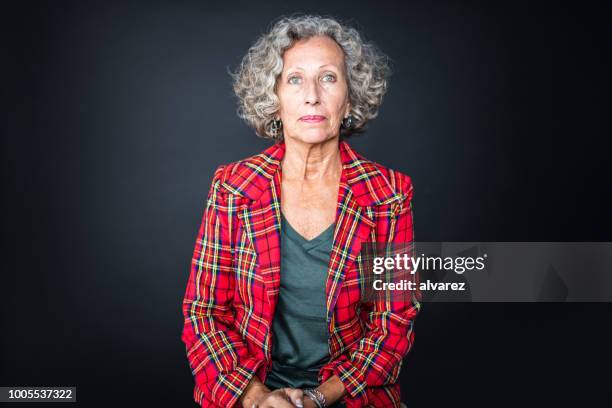 portrait of senior woman in red plaid shirt - open grave stock pictures, royalty-free photos & images